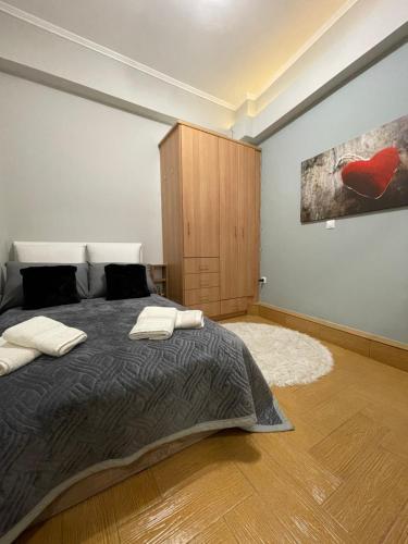 a bedroom with a bed with two pillows on it at Nemeapolis 2 apt in Neméa
