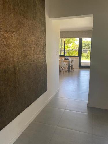 a living room with a large painting on the wall at Excelente Loft con terraza verde y ducha in San Isidro
