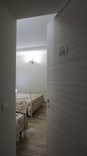 a door leading to a room with two bunk beds at Affittacamere Arco Antico in Cusano Mutri