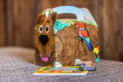 a wooden bag with a cartoon dog on it at Pier 5 Hotel in Aalborg