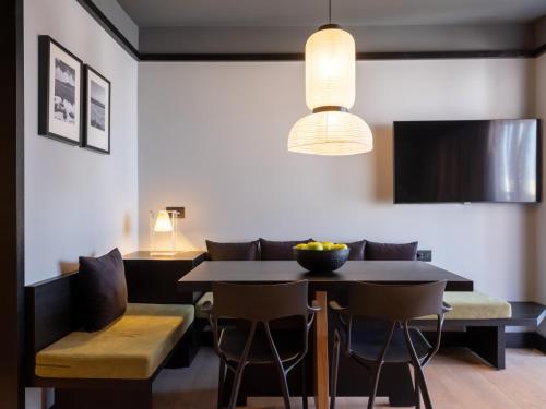 a dining room with a table and chairs at 3 Pines Design Living in Heraklio Town