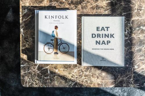 a couple of books sitting on top of a table at Pier 5 Hotel in Aalborg