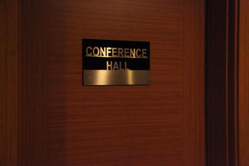 a sign on a door that reads entrance hall at Merci Hotel Erbil in Erbil