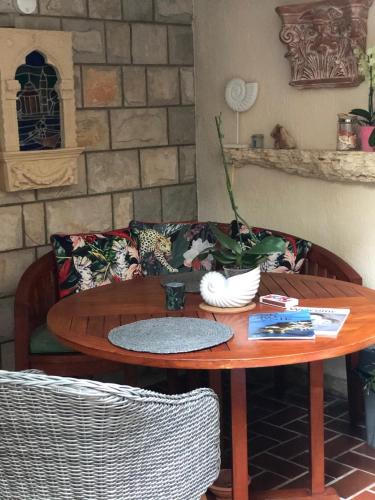 a coffee table and a couch in a living room at Flower House - Lapad in Dubrovnik