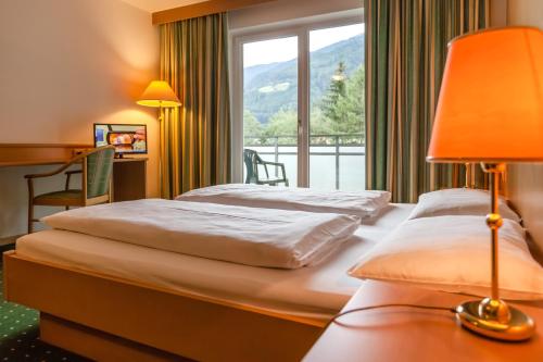 En eller flere senge i et værelse på Hotel Brenner - Stop & Go