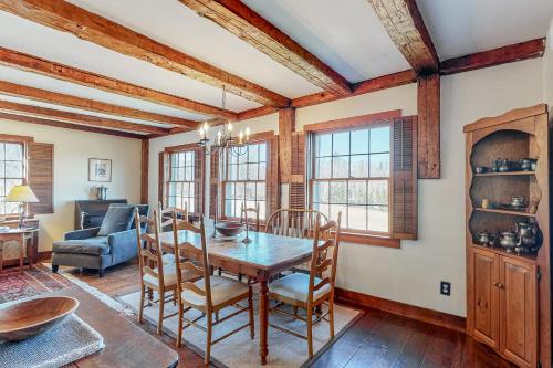 a dining room with a table and chairs at Vermont Mountain Farmhouse in Ludlow