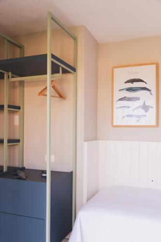 a bedroom with a bed and a bunk bed at Øko Villa in Juquei