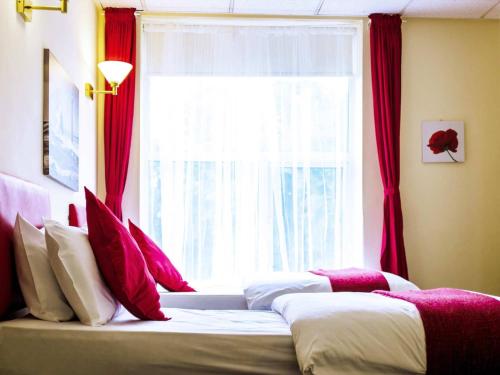 Cama o camas de una habitación en The Devonshire House Hotel