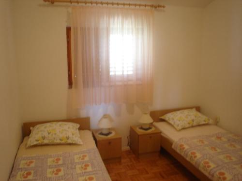 Posteľ alebo postele v izbe v ubytovaní Apartment View Razanac