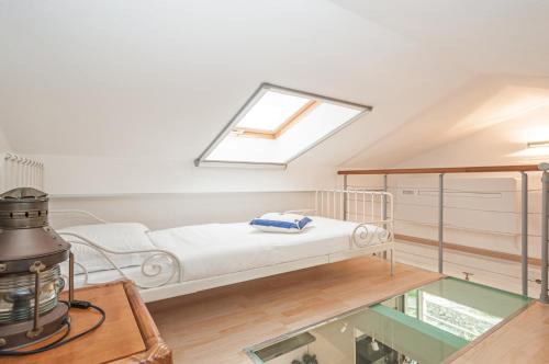 a hospital room with a bed and a window at The Boat House Portovenere in Portovenere