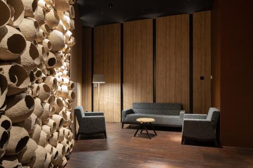 a waiting room with two chairs and a table at Emily Resort in Lviv