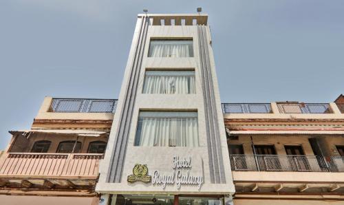 a tall building with a sign on the side of it at Itsy By Treebo - Royal Galaxy in Jahāngīrābād