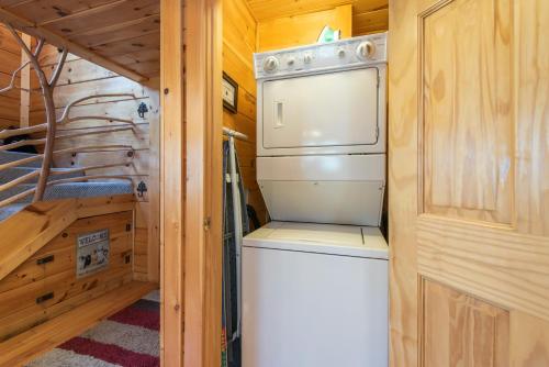 a washer and dryer in a tiny house at Bear Paw Trail in Sevierville