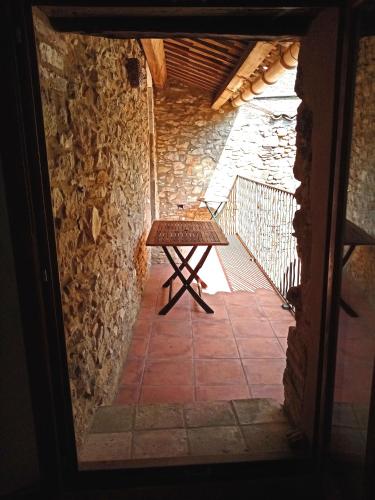 a view from the door of a room with a bench at Gîte passiflore in Frigoulet