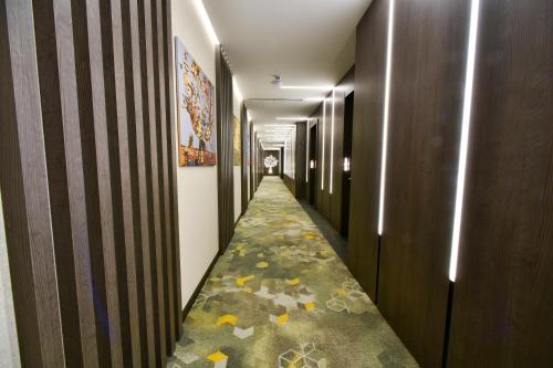 a corridor of a hallway with a long hallway at Bourbon Boutique Hotel in Yerevan