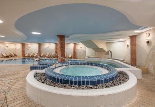a large swimming pool in a hotel room at Gai Beach Hotel in Tiberias