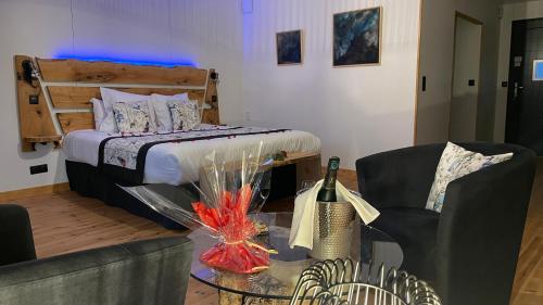 Katil atau katil-katil dalam bilik di Le Volcan des Sens, chambres d'hotes de luxe et SPA privatif