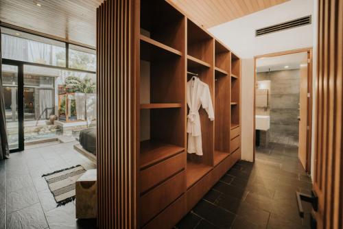 a room with a closet with wooden shelves at Kings Mansion for 26 guests! in Tulum