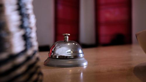 a silver bell sitting on top of a table at Villa Agapanthe in Fès