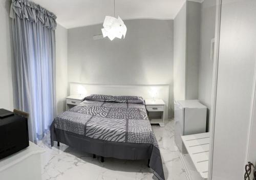 Postel nebo postele na pokoji v ubytování Casa Regina Margherita, possibilità di posteggio moto e bici