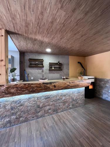 a kitchen with a stone counter top in a room at Casa Rural La Colmena in Condemios de Abajo