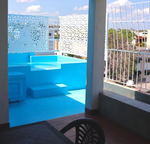 a view of a balcony with a swimming pool at Apartamentos En Edificio Amapola Zona Colonial Malecón in Santo Domingo
