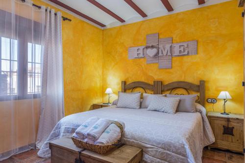 a bedroom with a bed and a sign that says love at El Mirador De Ruidera in Ruidera
