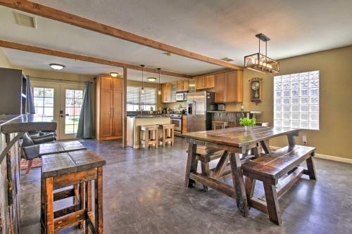a large kitchen with a wooden table and chairs at Work, Play, Explore! Cottage 2 Mi to Dtwn Phoenix in Phoenix