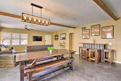 a living room with a table and a couch at Work, Play, Explore! Cottage 2 Mi to Dtwn Phoenix in Phoenix