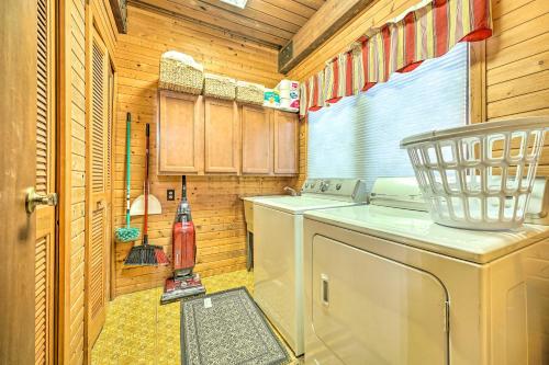 a kitchen with a washer and dryer in a house at Spacious Syracuse Getaway with Waterfront Deck! in Syracuse