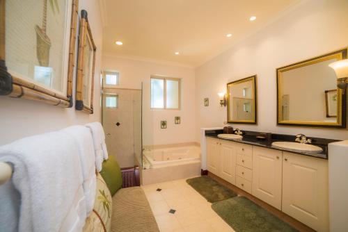 a bathroom with a sink and a bath tub at 3 bedroom Bella Vista 2D close to pool by Stay in CR in Herradura