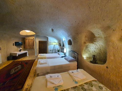 Postel nebo postele na pokoji v ubytování Karadut Cave Hotel