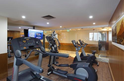 a gym with three exercise bikes in a room at Windsor Copa Hotel in Rio de Janeiro