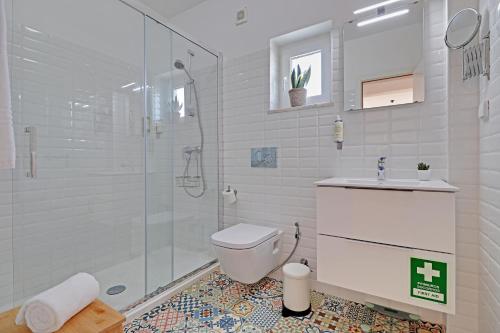 a bathroom with a shower and a toilet and a sink at SEA SALT SAGRES APARTMENT in Sagres