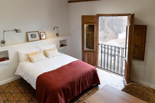 Ένα ή περισσότερα κρεβάτια σε δωμάτιο στο La Casa del Orfebre