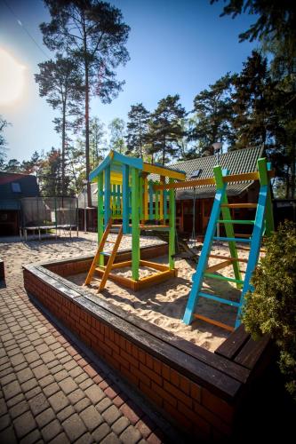a set of playground equipment in a park at Angela Domki i Pokoje in Pobierowo