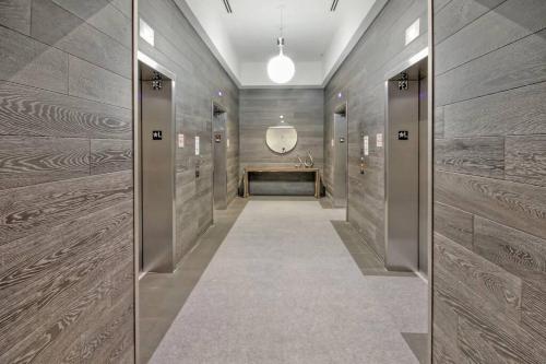 a hallway with a row of elevators in a building at Lunabase Heavenly View in Miami