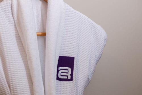 a close up of a white jersey with the letter e at Camino Real Aeropuerto in Mexico City