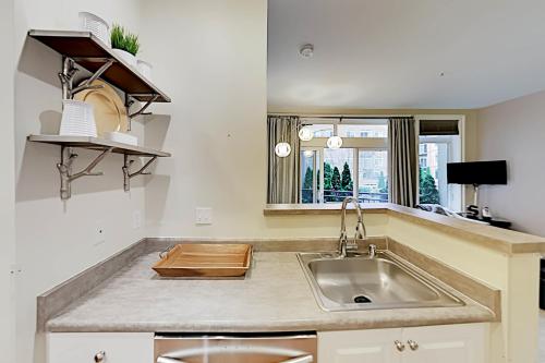 a kitchen with a sink and a window at Belltown Court III in Seattle