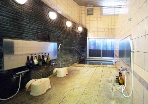 a large room with bottles of wine on a wall at ATAMI SPRING TERRACE HOTEL in Atami