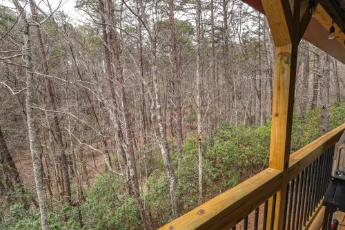 a view of the woods from the porch of a cabin at Cozy Bear Cabin #1 in Sautee Nacoochee