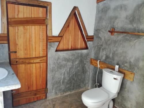 a bathroom with a toilet and a sink at Sigiriya Freedom Lodge in Dambulla