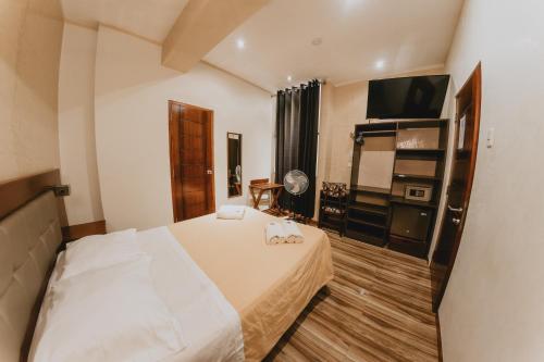 Ένα ή περισσότερα κρεβάτια σε δωμάτιο στο Shushupe Hotel