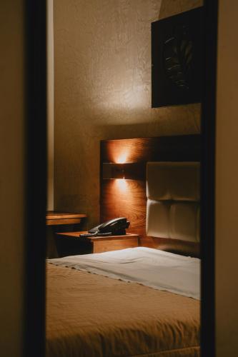 Ένα ή περισσότερα κρεβάτια σε δωμάτιο στο Shushupe Hotel