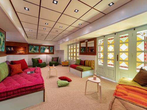 a large living room with a couch and chairs at STAY Rhodes Hotel in Rhodes Town