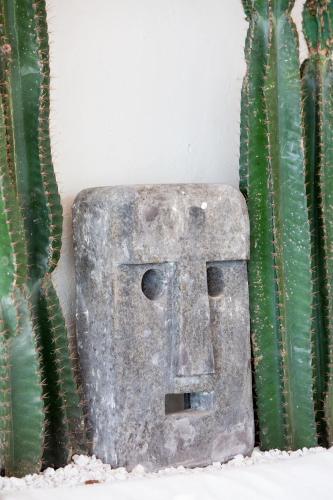 a stone block next to a green cactus at Cielo Boutique Hotel & Spa Samui in Bophut 