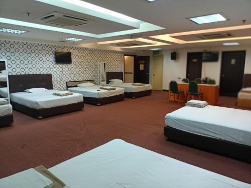 Postel nebo postele na pokoji v ubytování Hotel Sri Sutra PJ 222