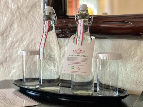 two bottles of water sitting on a shelf at Sarova Lion Hill Game Lodge in Nakuru