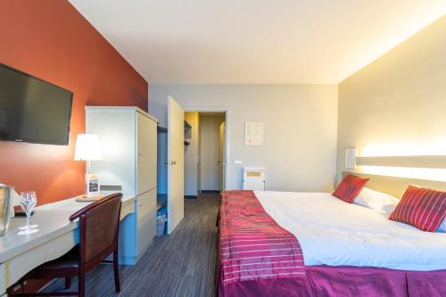 Postel nebo postele na pokoji v ubytování Hotel Ambiotel