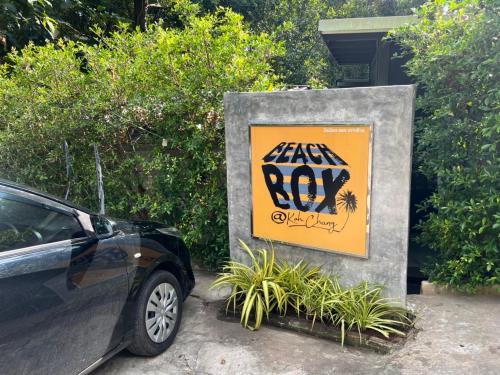 a car parked next to a sign that says lazy boy at BeachBox@Koh Сhang in Ko Chang